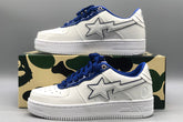 A Bathing APE white & navy patent leather sneakers
