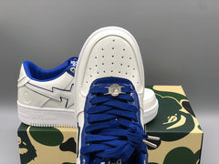 A Bathing APE  white & navy patent leather sneakers